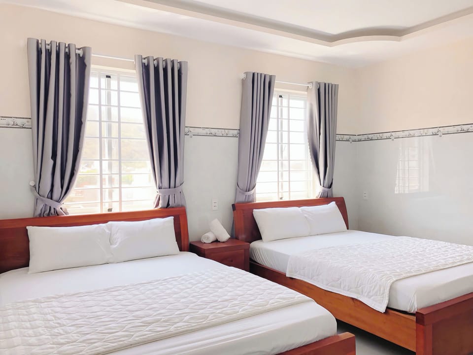 Standard Quadruple Room, City View | Desk, free WiFi