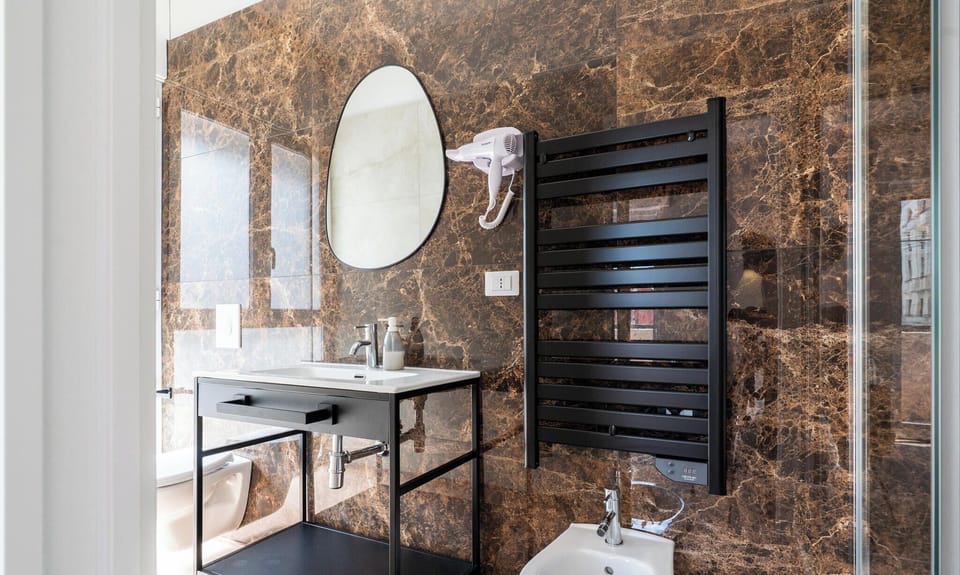 Deluxe Triple Room | Bathroom | Shower, hair dryer, towels, soap