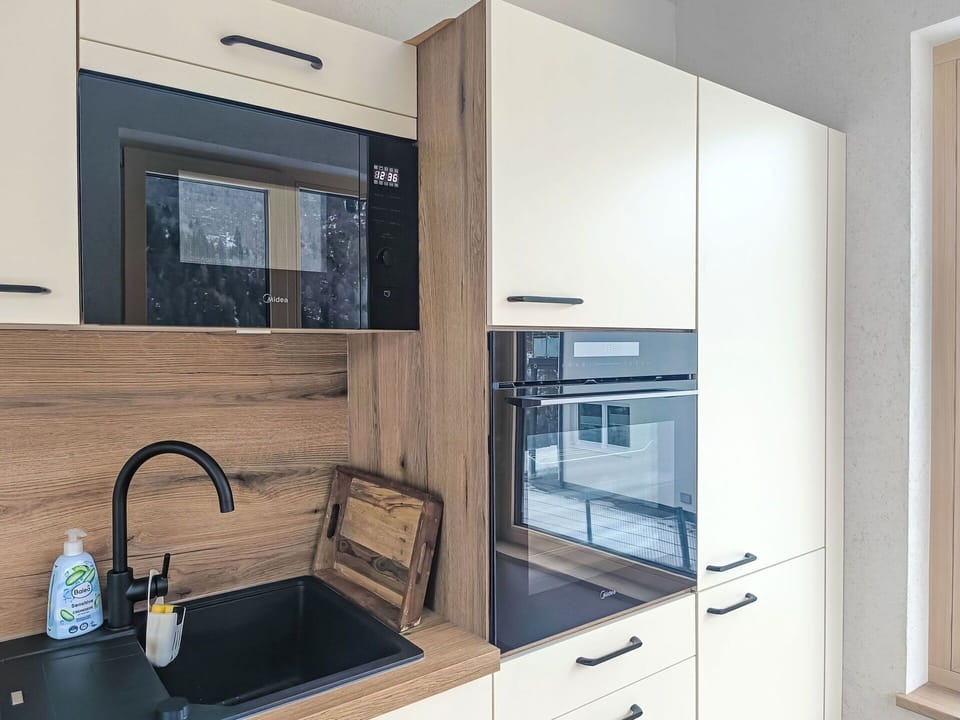 Interior Design, Cabinetry, Kitchen Appliance, Kitchen, Countertop, Wood, Flooring, Major Appliance, Furniture, Home Appliance