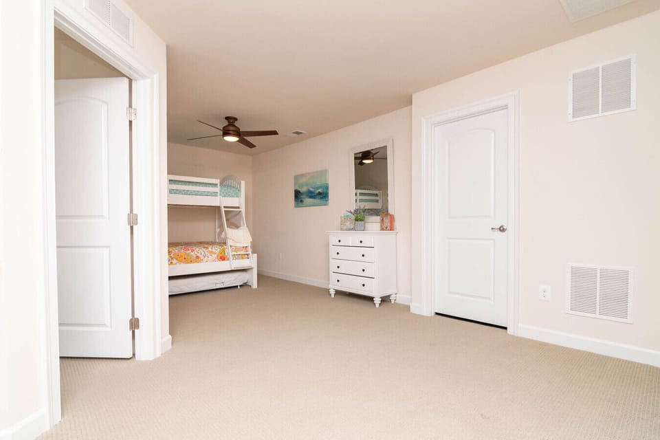 Fun and functional loft space with bunk beds and a trundle, ideal for larger groups.