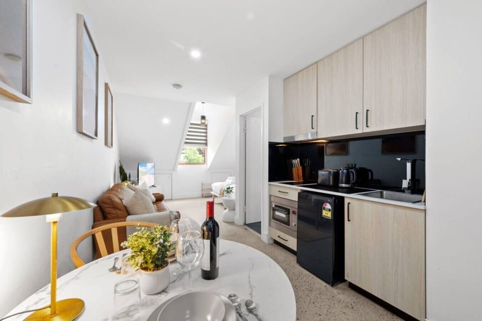Seamless kitchen and dining layout for effortless cooking, dining, and unwinding.