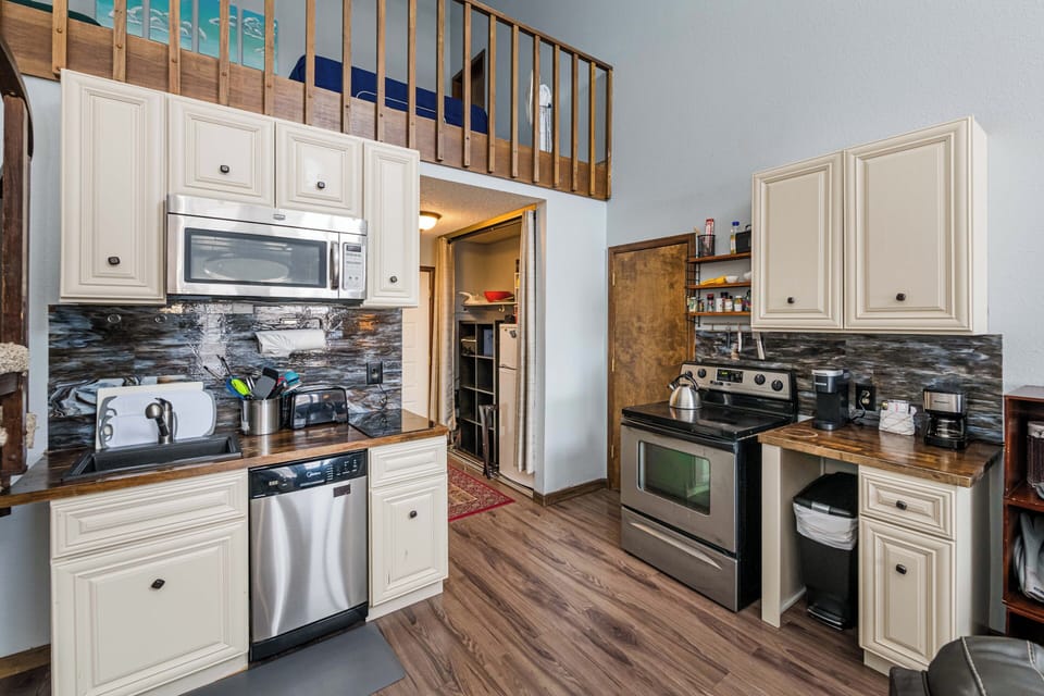 Your fully equipped kitchen offers everything you needs at 643 SilverCreek Inn, from stainless steel appliances to elegant stone countertops and warm wood floors.