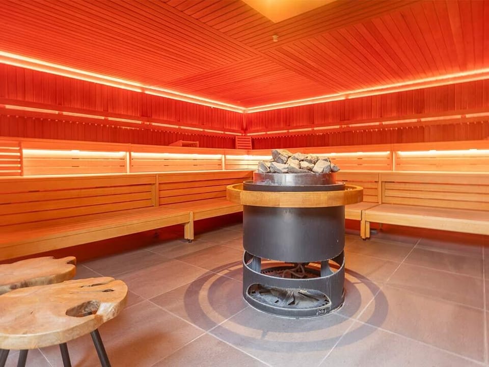 Unwind in a warm cedar sauna for deep relaxation.