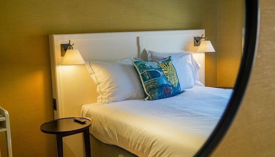 Sink into soft pillows and warm bedside lighting nightly.