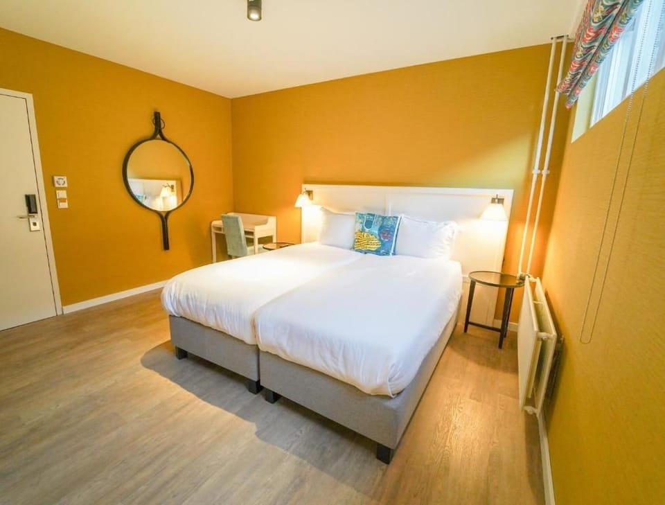 Refresh and recharge in a spacious room with a work desk.