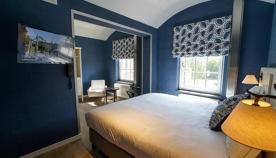 Drift off under soft lighting with calming blue design accents