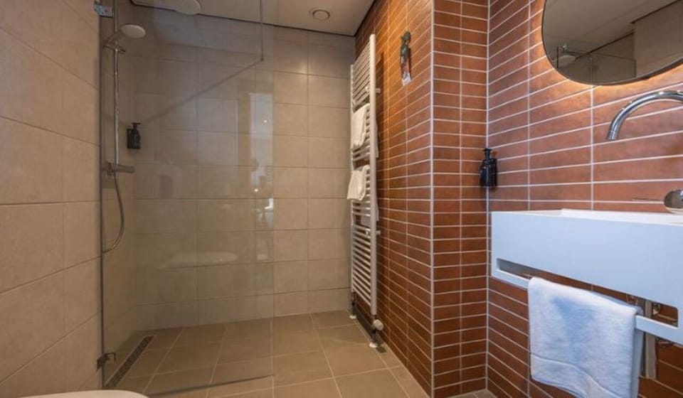 Freshen up in the modern ensuite with walk-in shower.