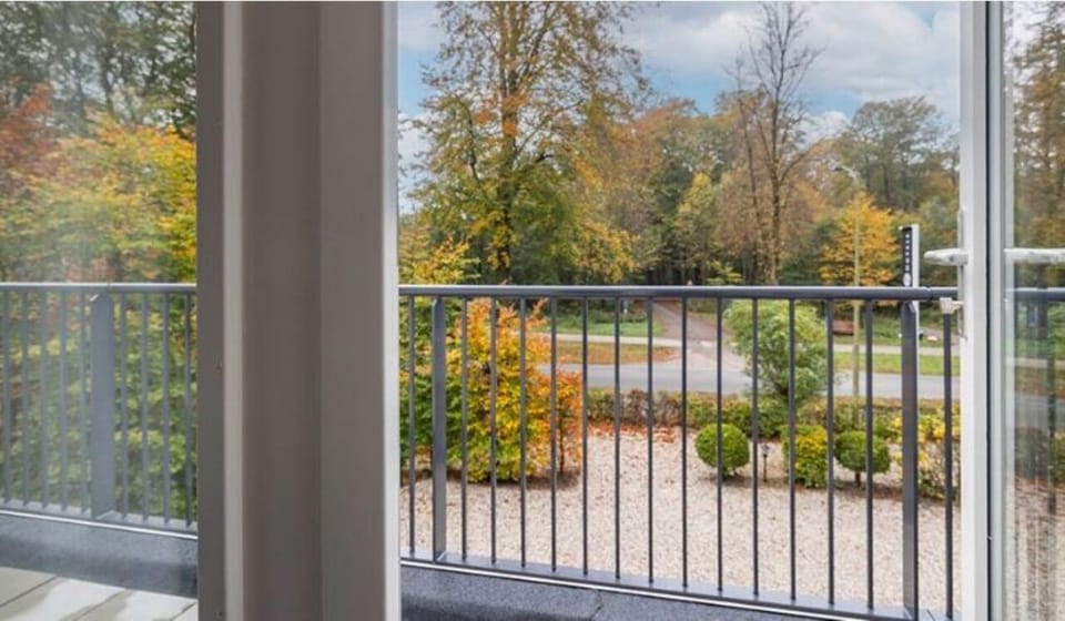 Step onto the balcony and breathe in leafy, peaceful views.
