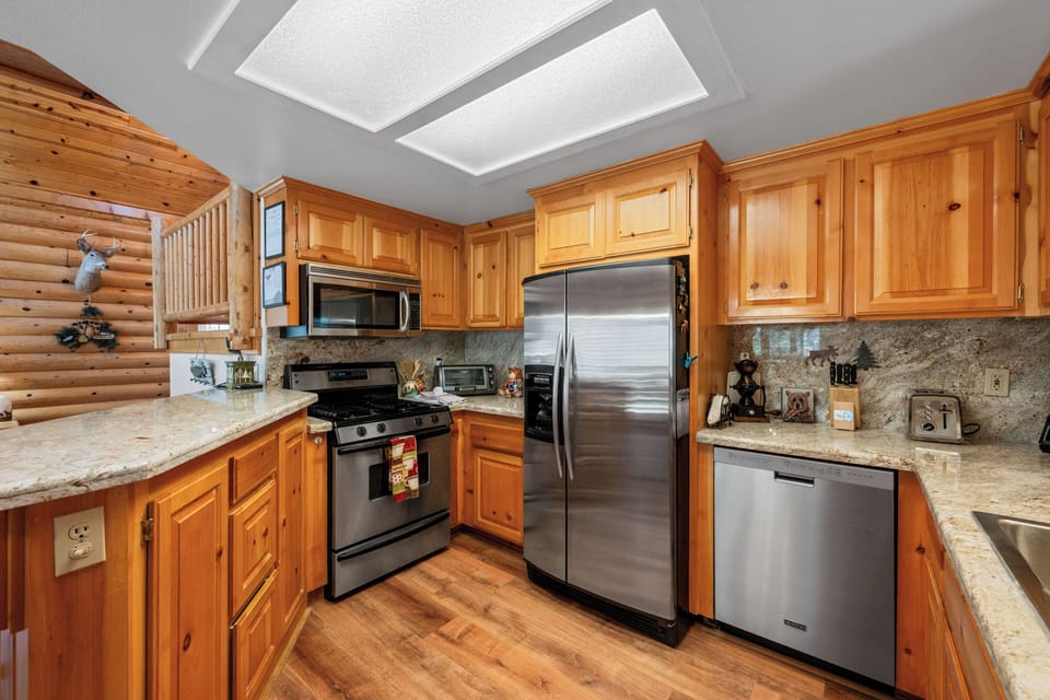 Full Kitchen - Full Kitchen with dishwasher, toaster, toaster oven, microwave. fridge, icemaker, freezer, stove and oven, coffee pot, blender, and everything else you need for cooking.