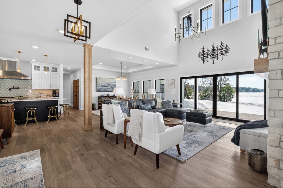 Unwind in this stunning open-concept living space where soaring ceilings and elegant lighting create an atmosphere of luxury and comfort.