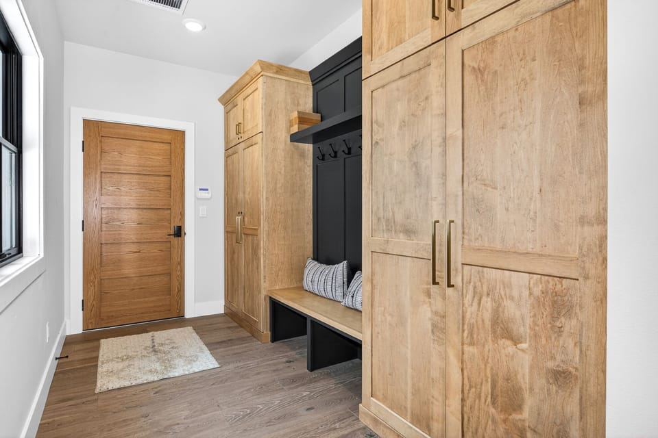 You'll love the organized entryway with built-in storage and cozy bench—perfect for stowing gear after your adventures.