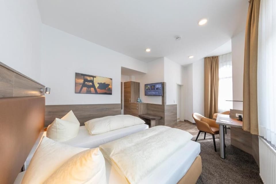 Standard Double or Twin Room, City View | Down comforters, minibar, desk, blackout drapes