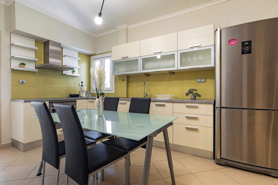 Fully equipped kitchen with dining area, modern appliances, and plenty of space for home-cooked meals.