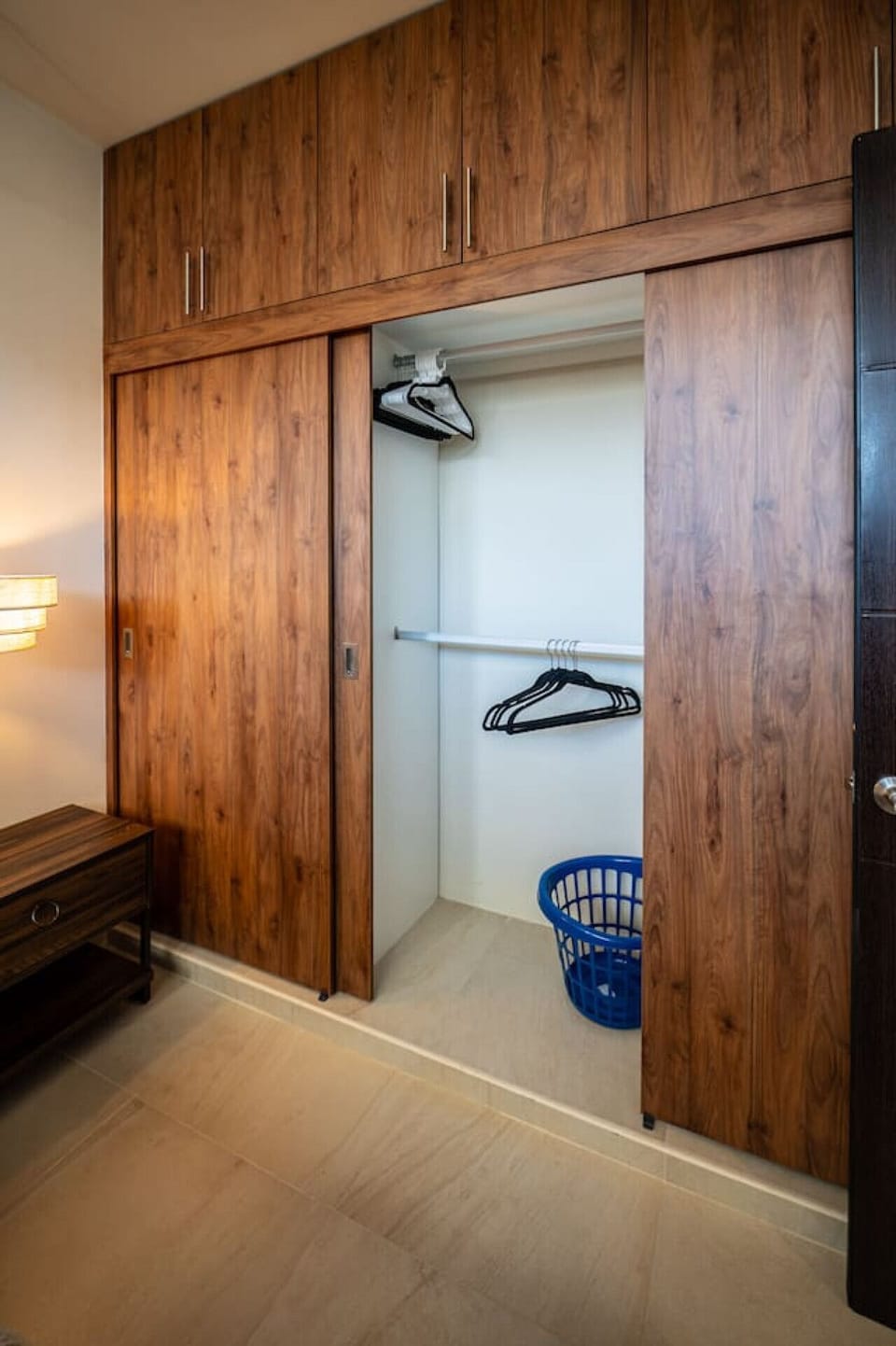 Spacious closet with beautiful wooden sliding doors and plenty of room to keep everything organized.