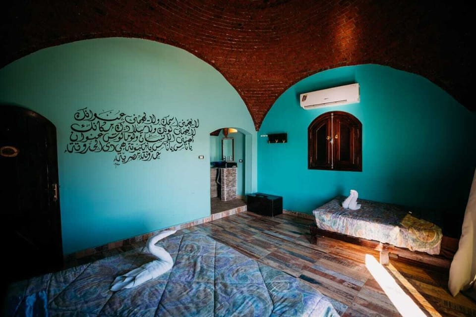 Deluxe Triple Room, Private Bathroom (Nile View) | Desk, soundproofing, bed sheets