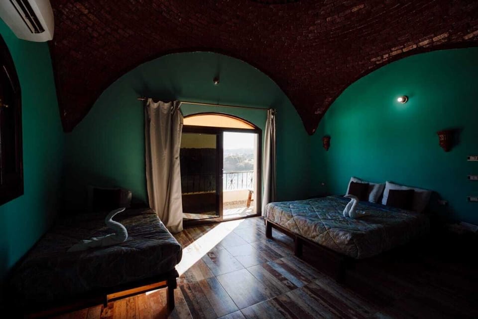Deluxe Triple Room, Private Bathroom (Nile View) | Desk, soundproofing, bed sheets