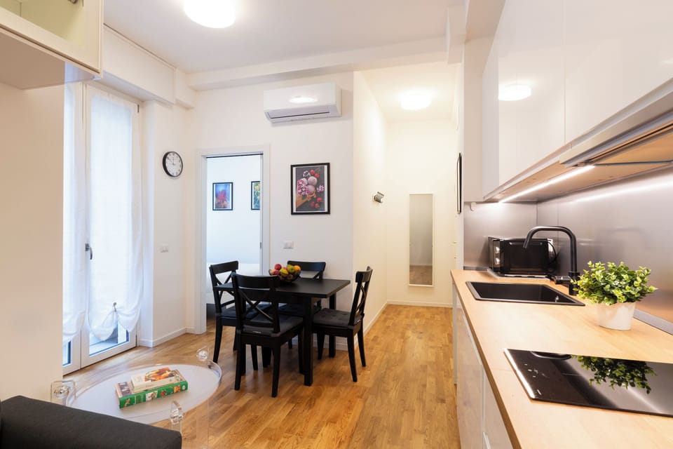 Comfort Apartment, Balcony | Living area | 32-inch Smart TV with digital channels