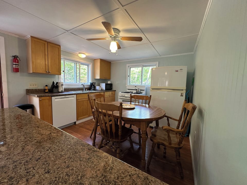 Your fully equipped kitchen awaits and a cozy dining table where you can savor home-cooked meals together.