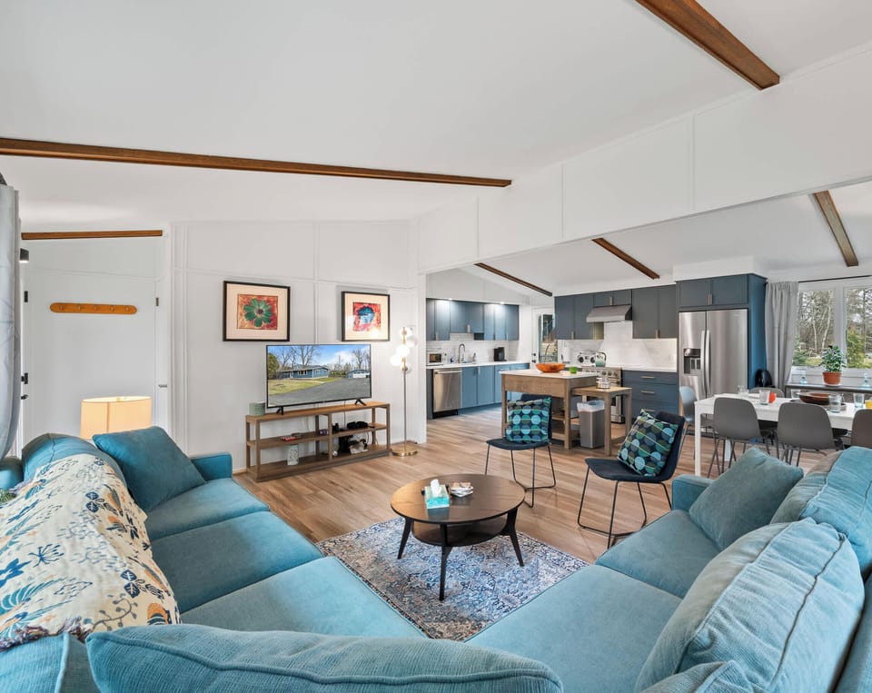 Experience the seamless flow between the kitchen, dining, and living areas. This open layout ensures you never miss a moment with family or your four-legged friends while relaxing indoors.