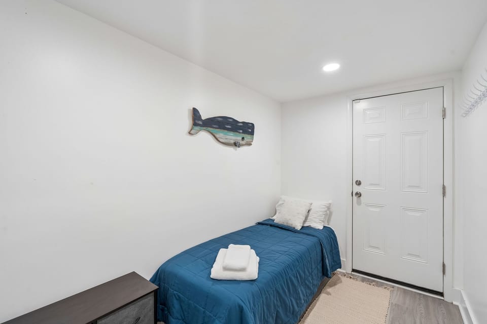 Drift off in your cozy ocean-themed bedroom, complete with whale art and fresh towels awaiting your arrival.