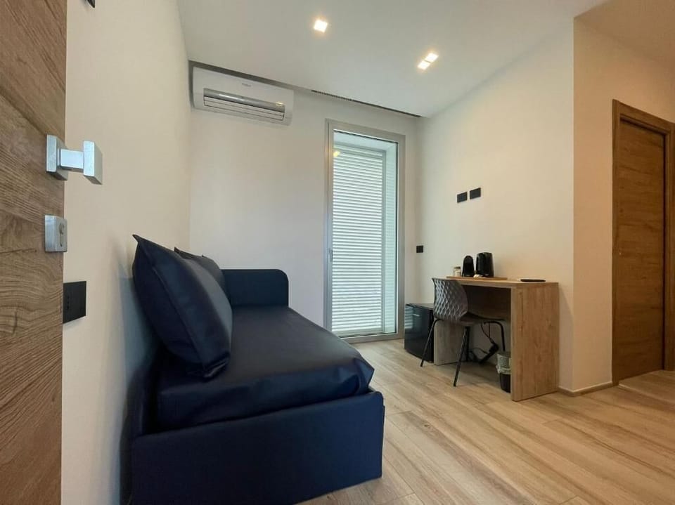 Double Room, Balcony | Living area | TV