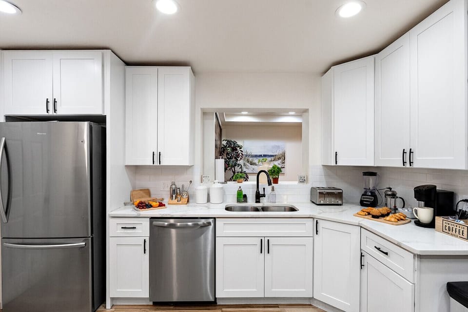 Bright, fully stocked kitchen designed for easy cooking and hosting.