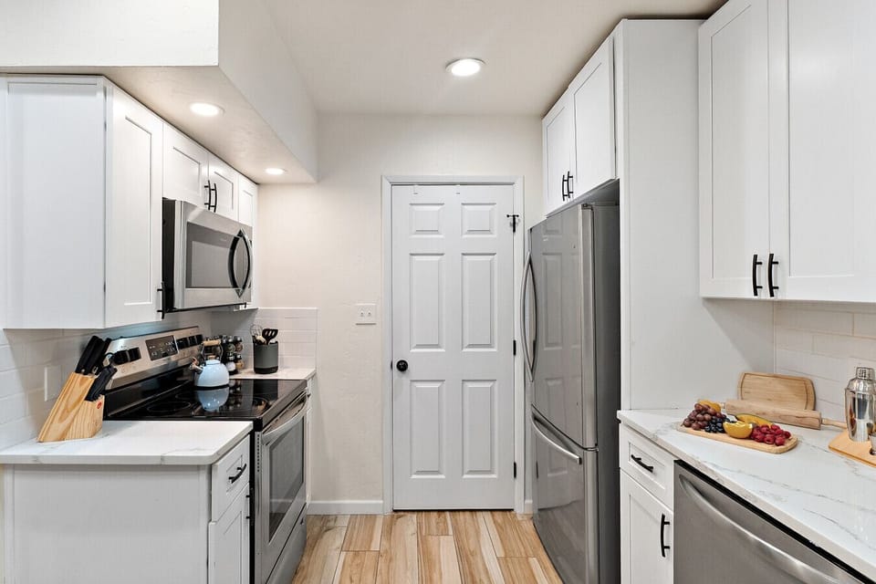 Modern kitchen with stainless appliances and plenty of counter space.