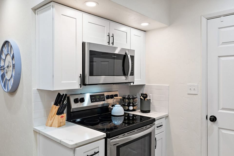 Fully equipped kitchen with modern appliances and essentials.