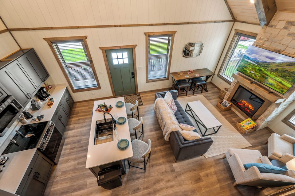 The spacious layout seamlessly connects the living, dining, and kitchen areas, perfect for relaxing or entertaining.