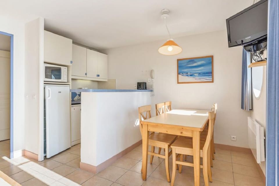 A well-equipped kitchenette invites you to whip up your favorite meals, with ample dining space nearby.