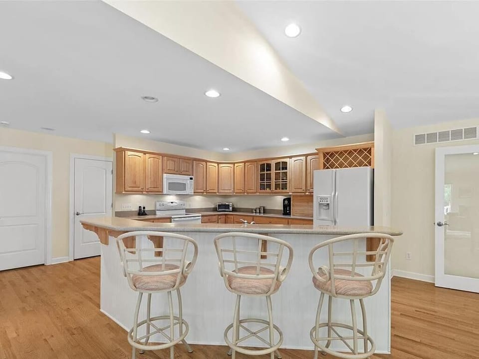 Gather around the spacious kitchen island, perfect for morning coffee or evening chats.