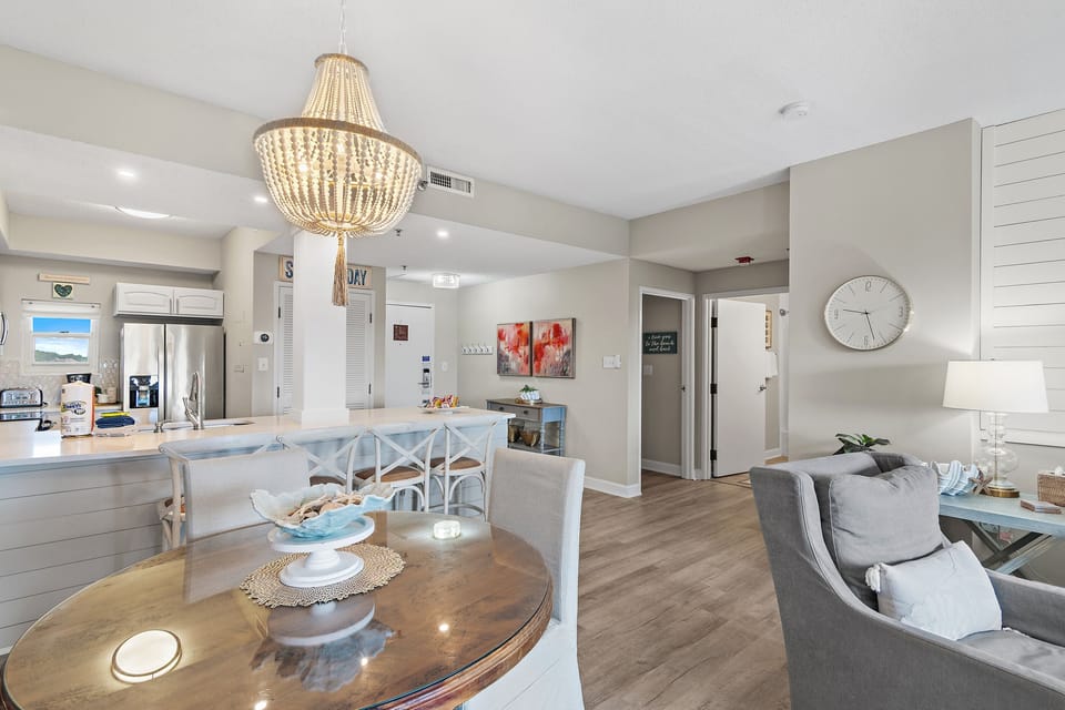 Tops'l Summit 405 has an open living area with Remodeled Kitchen, comfortable living room, Dining Space, and Balcony Access - all with state park, pool, and partial Gulf Views