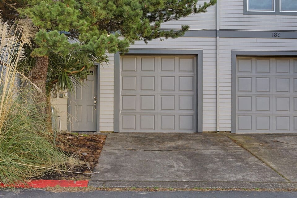 Entry door, driveway and garage to Krusemuir townhouse