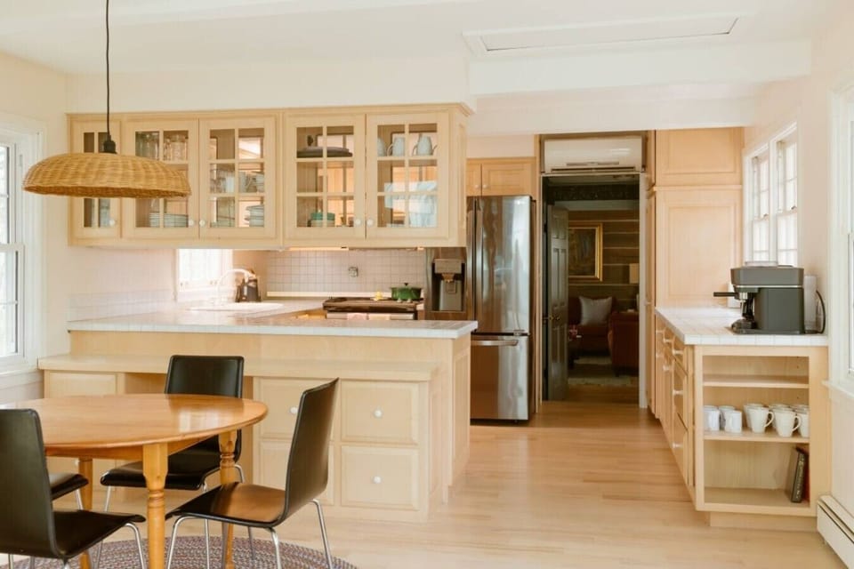 Sun-drenched kitchen blending historic charm with modern comfort