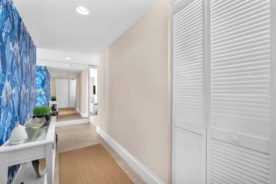 Unit entrance with a stylish entryway that leads directly into the living space and kitchen.