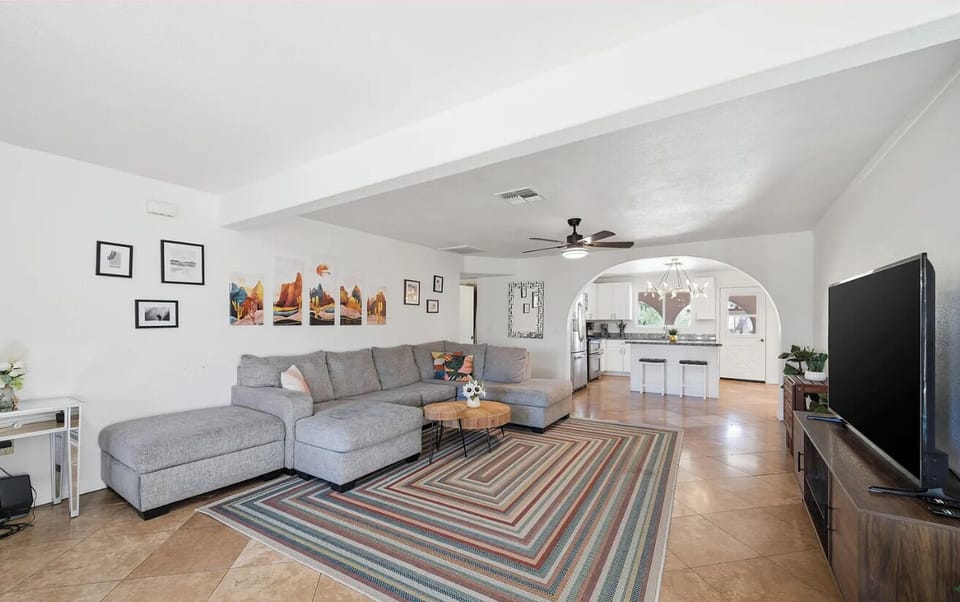 Gather in the cozy living room, where stories flow and movie nights stretch into late laughs 🧡✨