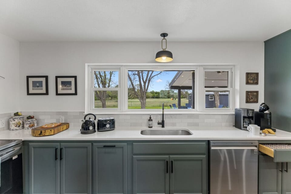Kitchen | Grey Cabinetry | Window View & White Countertops