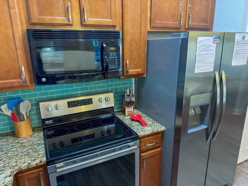 The gourmet kitchen combines coastal charm with ample prep space for preparing meals and entertaining with ease.