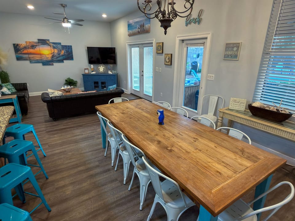 Gather, dine, and unwind with a layout that connects seamlessly to the screened-in patio and tropical poolside retreat.