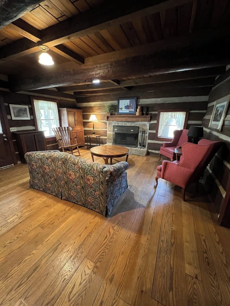 The living room features a fireplace that can be used from Labor Day until Memorial Day. The main entrance is to the left. 