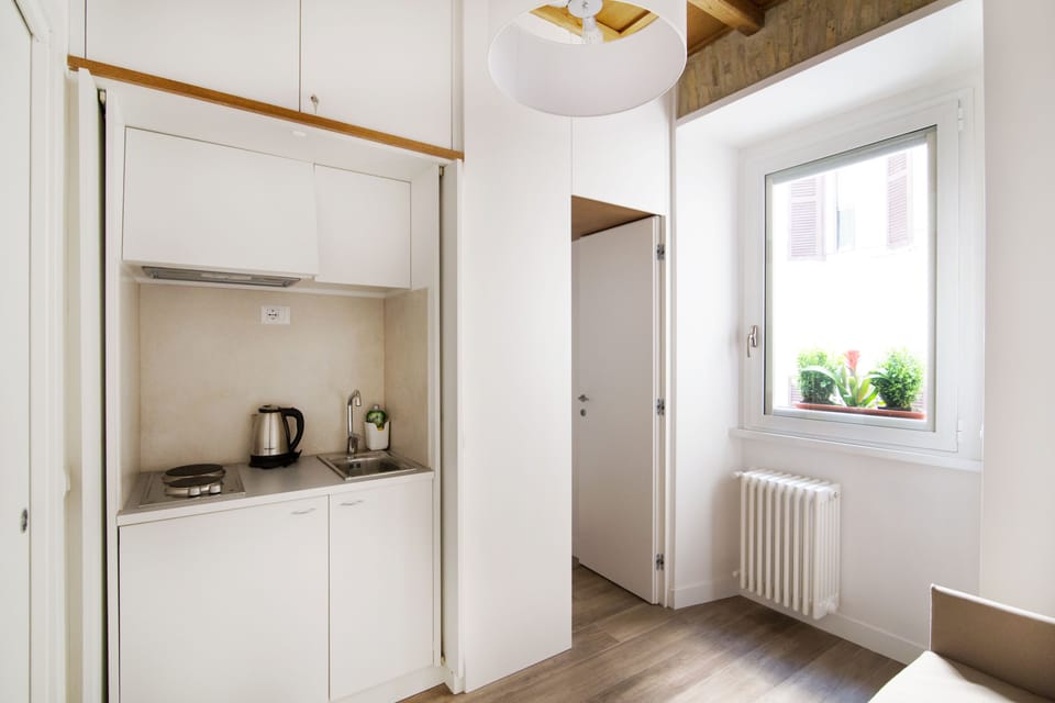 Deluxe Apartment, Kitchenette (Via Domenichino 5 - Rome) | Laptop workspace, soundproofing, iron/ironing board, free WiFi