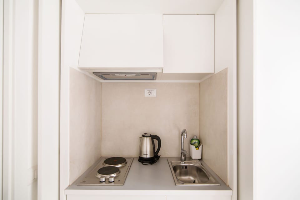 Deluxe Apartment, Kitchenette (Via Domenichino 5 - Rome) | Private kitchenette | Fridge, microwave, coffee/tea maker, toaster