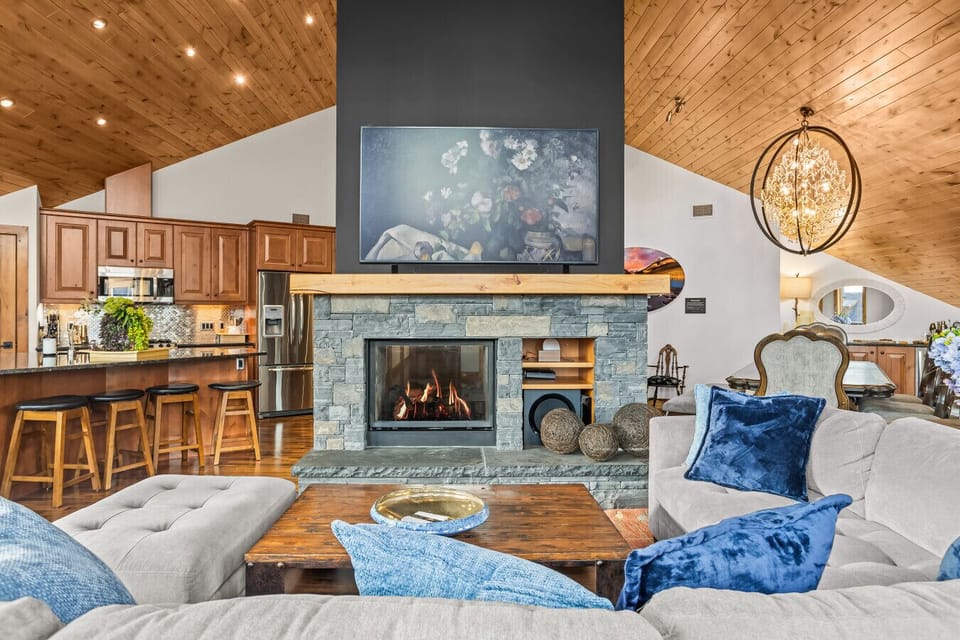 Centerpiece fireplace anchors the space—cook, dine, and relax together.