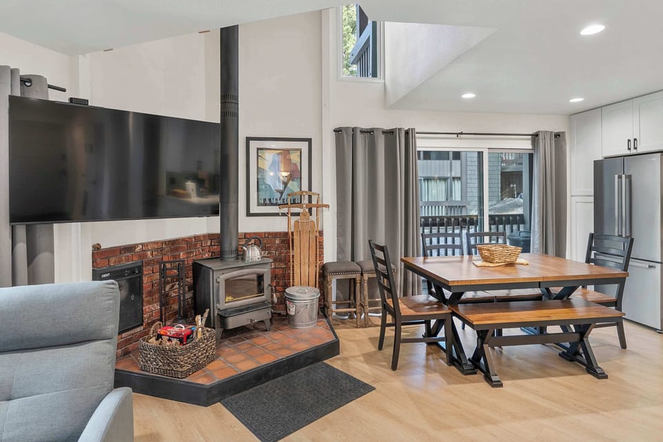 Cozy open-concept space with fireplace.
