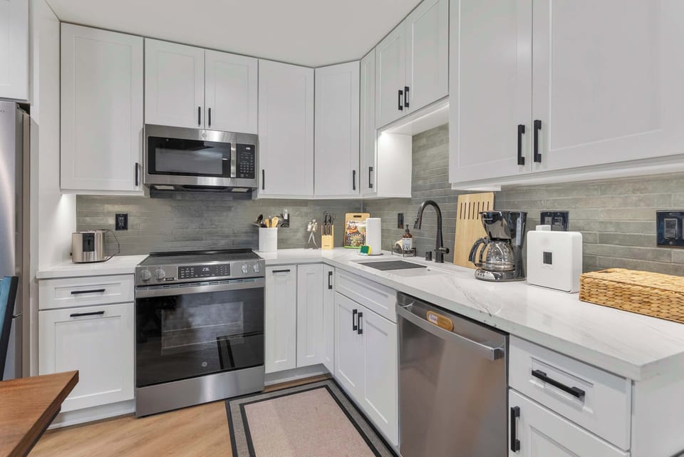 Sleek kitchen with stainless appliances.