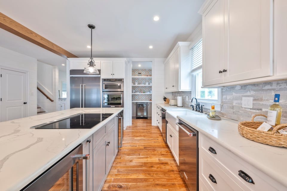The sleek kitchen features modern appliances and plenty of counter space for culinary adventures.