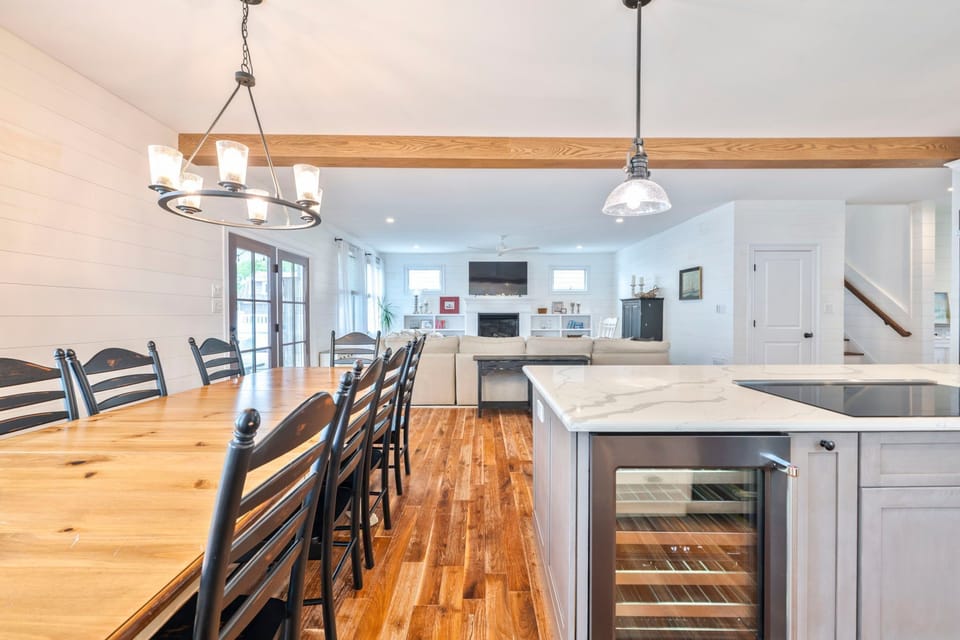 Bask in the warm glow of the dining area, leading to a comfy living space with a cozy ambiance.