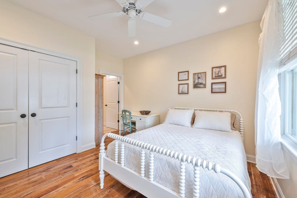 Enjoy a tranquil space with a comfy queen bed, adorned with stylish decor and soft linens for restful nights.