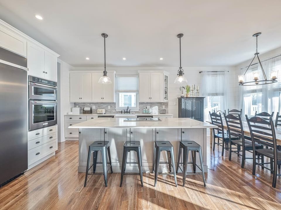 Gather around the spacious kitchen island, perfect for casual breakfasts and late-night chats.