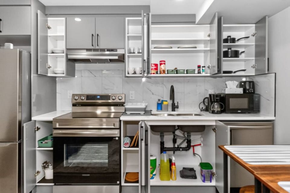 Modern kitchen with stainless steel appliances and full setup